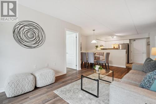 205 - 1450 Main Street E, Milton (Dempsey), ON - Indoor Photo Showing Living Room