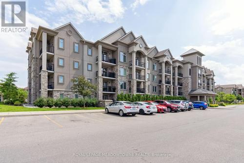 205 - 1450 Main Street E, Milton (Dempsey), ON - Outdoor With Balcony With Facade