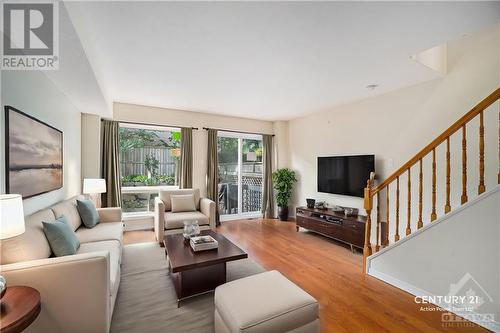 This photo is virtually staged. - 7 Festive Private, Ottawa, ON - Indoor Photo Showing Living Room