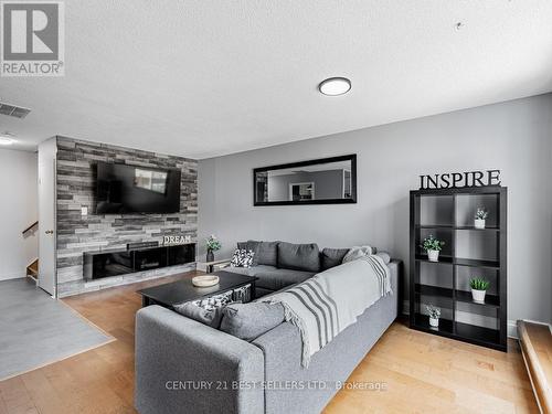 230 - 1055 Dundas Street E, Mississauga (Applewood), ON - Indoor Photo Showing Living Room With Fireplace