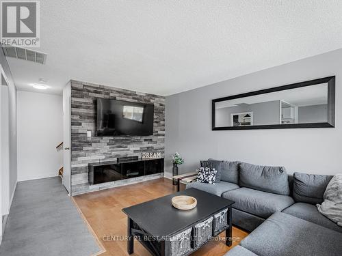 230 - 1055 Dundas Street E, Mississauga, ON - Indoor Photo Showing Living Room With Fireplace