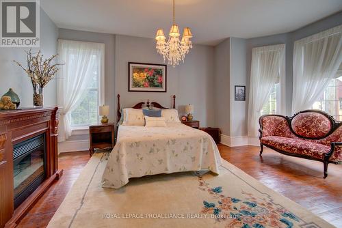 7 Drummond Street, Rideau Lakes, ON - Indoor Photo Showing Bedroom With Fireplace