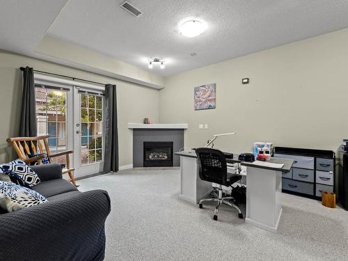 501-875 Sahali Terrace, Kamloops, BC - Indoor With Fireplace