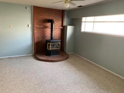 2402 Clapperton Ave, Merritt, BC - Indoor Photo Showing Other Room With Fireplace