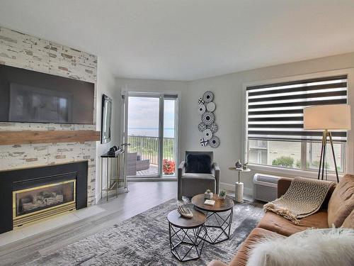 Living room - 5 Rue Des Villas, La Malbaie, QC - Indoor Photo Showing Living Room With Fireplace