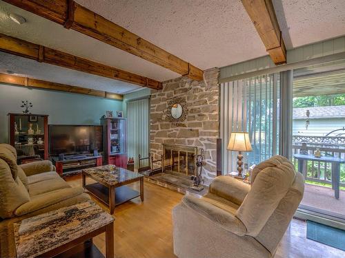 Living room - 1202 Rue Des Saules, Prévost, QC - Indoor Photo Showing Living Room With Fireplace