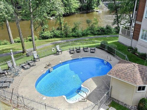 Pool - 101-77 Prom. Des Îles, Laval (Chomedey), QC - Outdoor With In Ground Pool