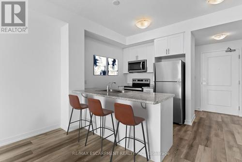 807 - 470 Dundas Street E, Hamilton (Waterdown), ON - Indoor Photo Showing Kitchen With Stainless Steel Kitchen With Double Sink