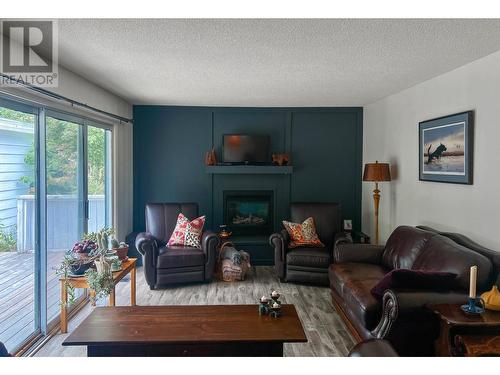 3016 1St Avenue, Castlegar, BC - Indoor Photo Showing Living Room With Fireplace