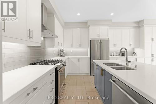 48 Pridham Place, New Tecumseth (Tottenham), ON - Indoor Photo Showing Kitchen With Stainless Steel Kitchen With Double Sink With Upgraded Kitchen