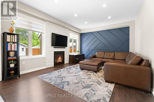 48 Pridham Place, New Tecumseth (Tottenham), ON - Indoor Photo Showing Living Room With Fireplace