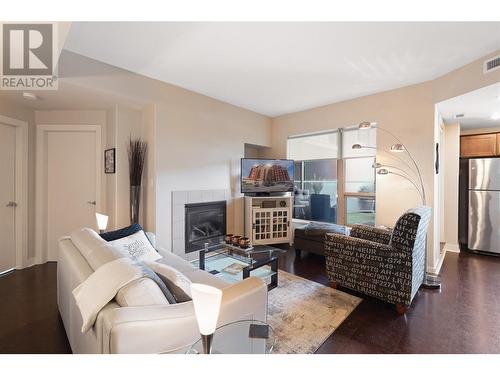 1160 Bernard Avenue Unit# 212, Kelowna, BC - Indoor Photo Showing Living Room With Fireplace