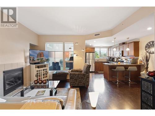 1160 Bernard Avenue Unit# 212, Kelowna, BC - Indoor Photo Showing Living Room With Fireplace