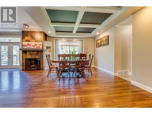 9291 Chinook Road, Vernon, BC - Indoor Photo Showing Dining Room With Fireplace