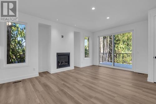 2070 Fisher Road, Kelowna, BC - Indoor Photo Showing Living Room With Fireplace