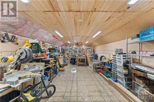 Workshop above garage - 6960 511 Highway, Lanark Highlands, ON - Indoor Photo Showing Garage