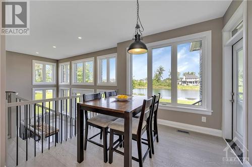 Complete Wall of Windows overlooking the water - 556 Shoreway Drive, Ottawa, ON - Indoor Photo Showing Dining Room