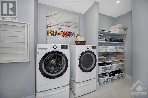 2nd Floor Laundry & Linen room includes wash sink & cabinets - 556 Shoreway Drive, Ottawa, ON - Indoor Photo Showing Laundry Room