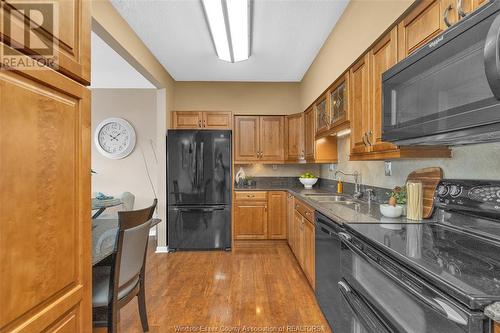 3663 Riverside Drive Unit# 904, Windsor, ON - Indoor Photo Showing Kitchen With Double Sink