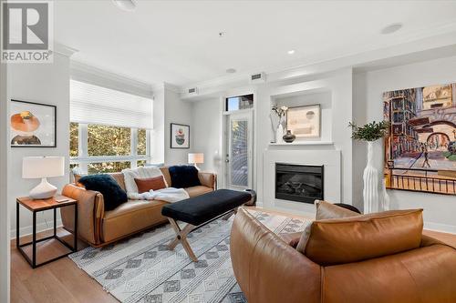 2901 Abbott Street Unit# 220, Kelowna, BC - Indoor Photo Showing Living Room With Fireplace