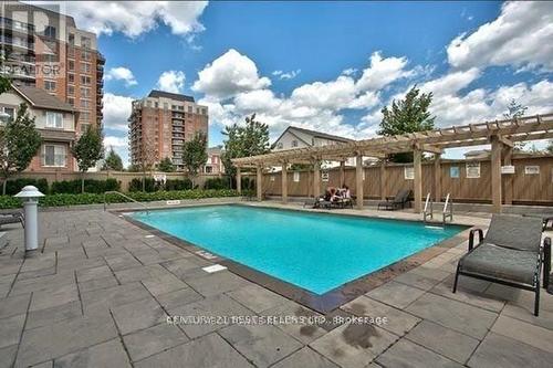 611 - 2325 Central Park Drive, Oakville (Uptown Core), ON - Outdoor With In Ground Pool