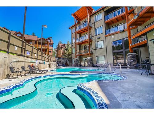 105 - 400 Stemwinder Drive, Kimberley, BC - Outdoor With In Ground Pool