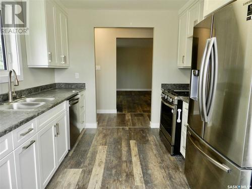 873 4Th Avenue Ne, Moose Jaw, SK - Indoor Photo Showing Kitchen With Double Sink