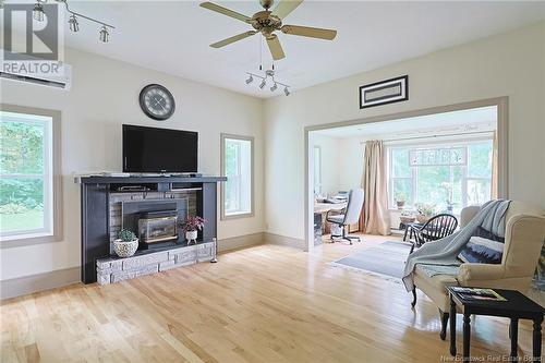 7054 Route 102, Dumfries, NB - Indoor Photo Showing Living Room With Fireplace