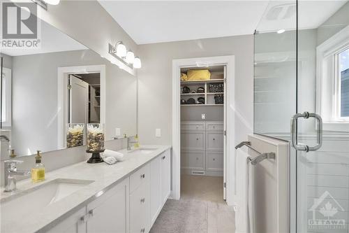 Master Ensuite leads into custom walk in closet - 4530 Kelly Farm Drive, Ottawa, ON - Indoor Photo Showing Bathroom