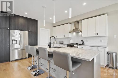 Custom millwork with pullout drawers and undercabinet lighting - 4530 Kelly Farm Drive, Ottawa, ON - Indoor Photo Showing Kitchen With Upgraded Kitchen