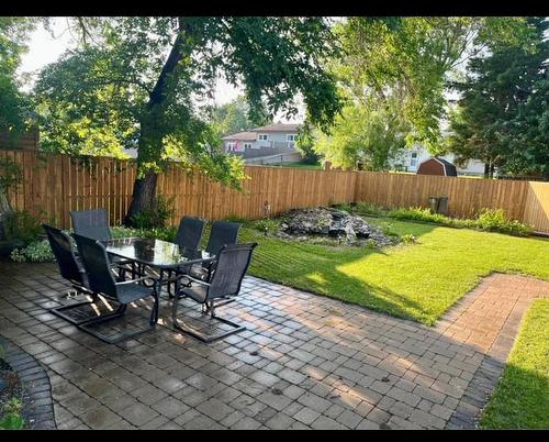 105 Elviss Crescent, Brandon, MB - Outdoor With Backyard