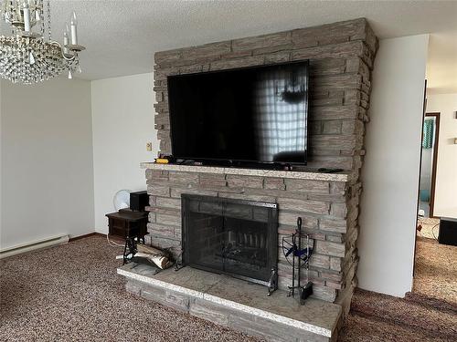 Ethelbert, Manitoba - Indoor Photo Showing Living Room With Fireplace