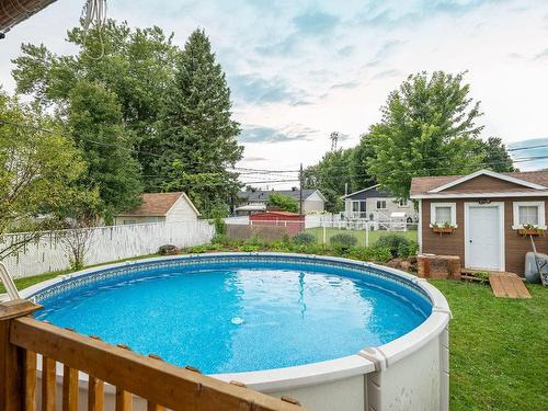 Piscine - 4100 Rue Barbeau, Longueuil (Saint-Hubert), QC - Outdoor With Above Ground Pool With Backyard