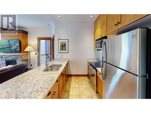 4559 Timberline Crescent Unit# 637 C & D, Fernie, BC - Indoor Photo Showing Kitchen With Fireplace With Stainless Steel Kitchen With Double Sink