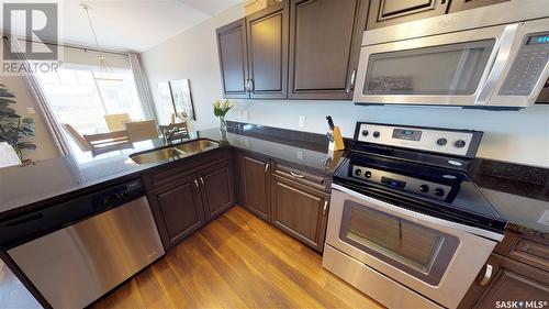 205 100 Chaparral Boulevard, Martensville, SK - Indoor Photo Showing Kitchen With Stainless Steel Kitchen With Double Sink