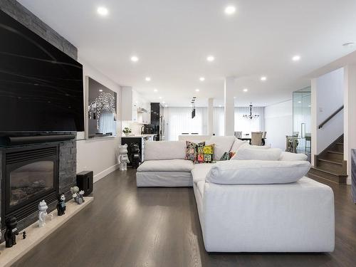 Living room - 4883 Rue Olivier-Maurault, Laval (Chomedey), QC - Indoor Photo Showing Living Room With Fireplace