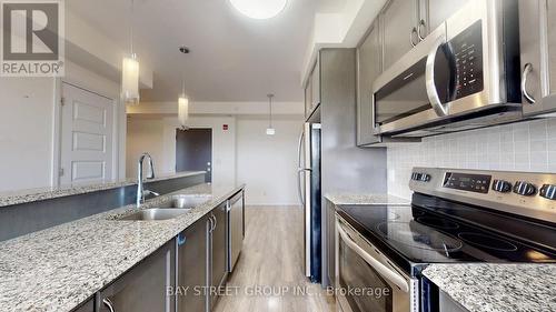 512 - 2 Adam Sellers Street, Markham, ON - Indoor Photo Showing Kitchen With Double Sink With Upgraded Kitchen