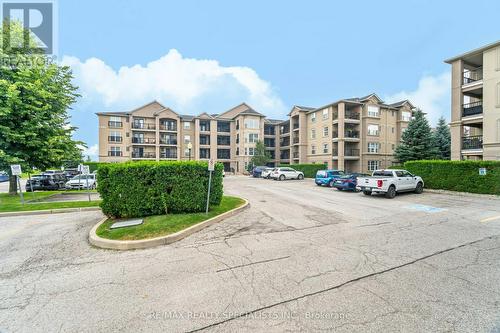 201 - 1491 Maple Avenue, Milton (Dempsey), ON - Outdoor With Balcony With Facade