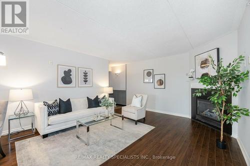 201 - 1491 Maple Avenue, Milton (Dempsey), ON - Indoor Photo Showing Living Room With Fireplace