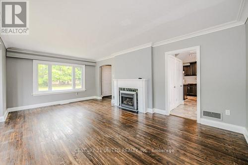 84 Glenridge Avenue, St. Catharines, ON - Indoor Photo Showing Living Room With Fireplace