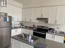 57 - 166 Deerpath Drive, Guelph (Parkwood Gardens), ON  - Indoor Photo Showing Kitchen With Stainless Steel Kitchen With Double Sink 