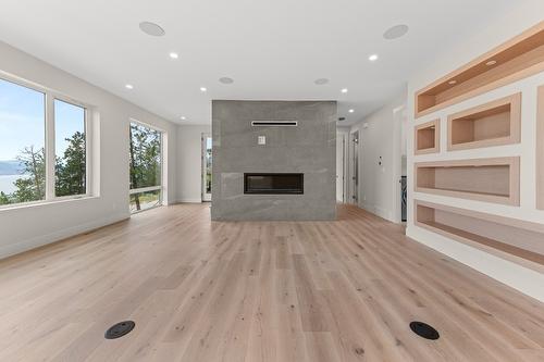 2980 Outlook Way, Naramata, BC - Indoor Photo Showing Living Room With Fireplace