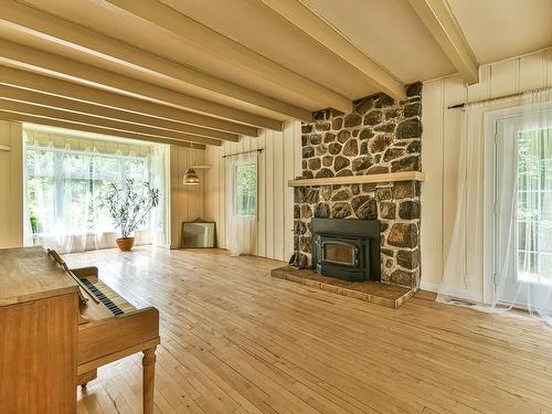 Salon - 1443 Rue Archambault, Sainte-Adèle, QC - Indoor Photo Showing Living Room With Fireplace