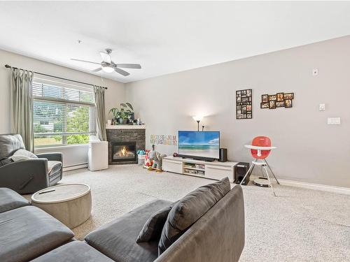 202-2115 Meredith Rd, Nanaimo, BC - Indoor Photo Showing Living Room With Fireplace