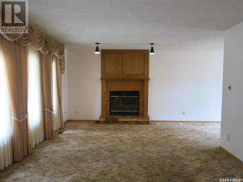 202 Boswell Street, Neudorf, SK - Indoor Photo Showing Living Room With Fireplace