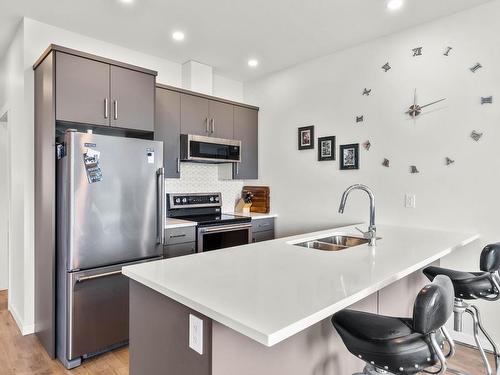 110-2925 Westsyde Rd, Kamloops, BC - Indoor Photo Showing Kitchen With Stainless Steel Kitchen With Double Sink With Upgraded Kitchen