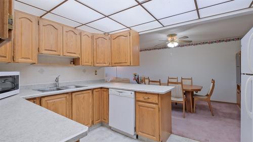 105-2110 Hoy Street, Kelowna, BC - Indoor Photo Showing Kitchen With Double Sink