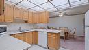 105-2110 Hoy Street, Kelowna, BC  - Indoor Photo Showing Kitchen With Double Sink 