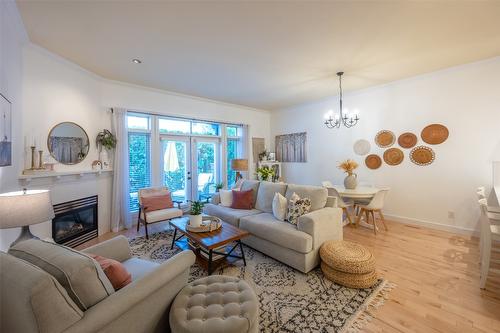 108-2629 Cornwall Drive, Penticton, BC - Indoor Photo Showing Living Room With Fireplace