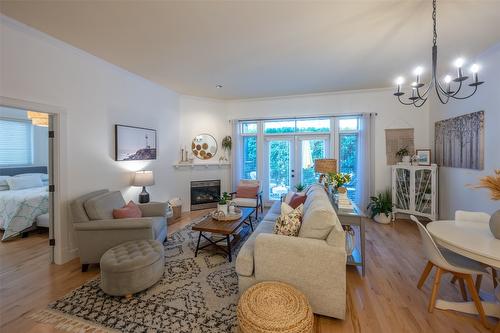 108-2629 Cornwall Drive, Penticton, BC - Indoor Photo Showing Living Room With Fireplace